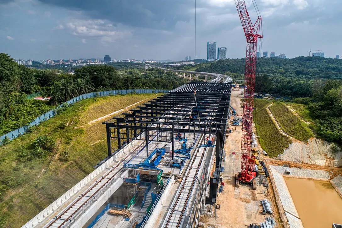 Aerial view of the station box steel structure roof truss installation in progress at the Cyberjaya Utara MRT Station site.
