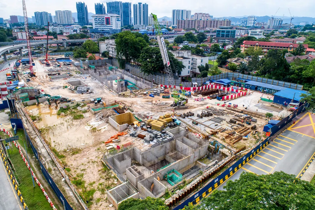 Aerial view of the Hospital Kuala Lumpur MRT Station site showing the reinforced concrete platform slab construction, architecture works and electrical and mechanical works in progress.