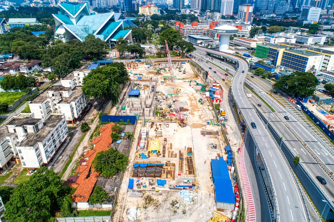Aerial view of the Hospital Kuala Lumpur MRT Station site showing the ongoing construction for vertical structures inside station and work preparation for entrances.