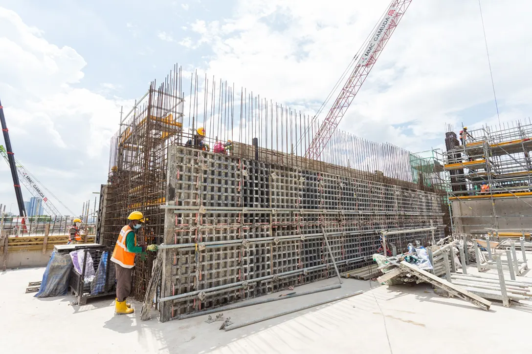 View of Hospital Kuala Lumpur MRT Station Entrance B reinforced concrete wall rebar and formwork installation in progress.