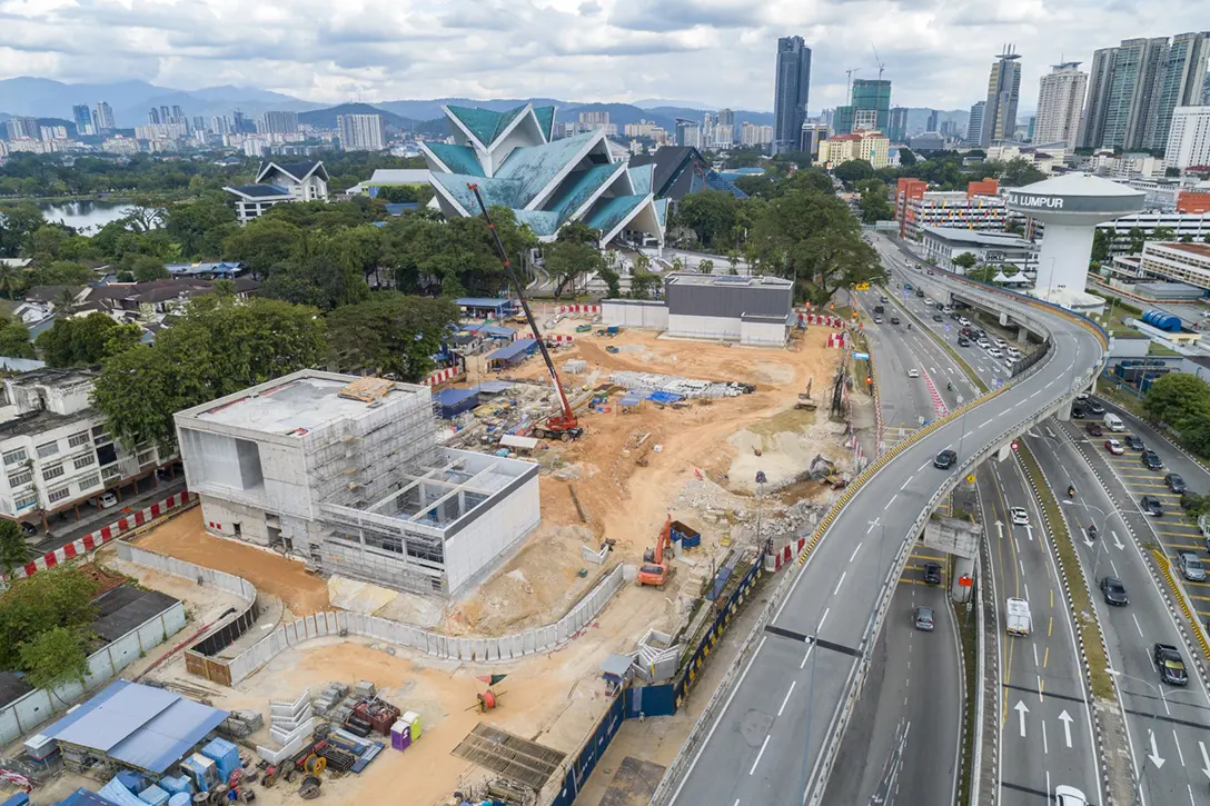 Aerial view of the Hospital Kuala Lumpur MRT Station showing the entrances reinforced concrete structures completed and ongoing external painting and plastering works.