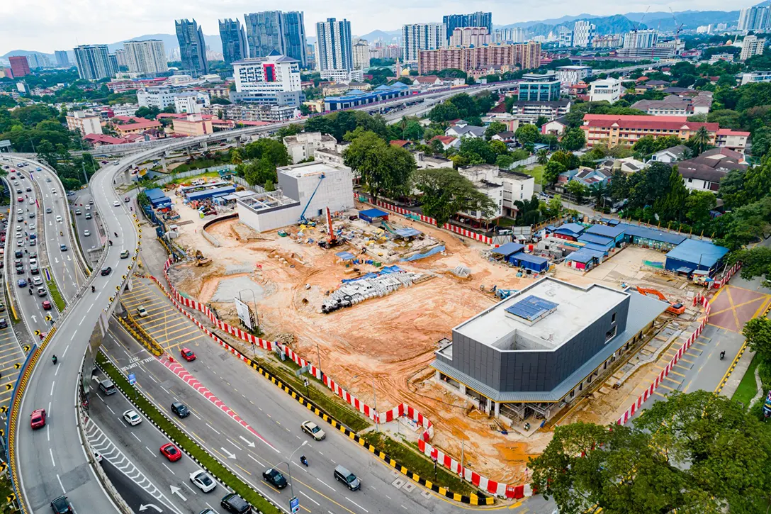 Aerial view of the Hospital Kuala Lumpur MRT Station showing the completion of entrance building and ongoing external and surface works.