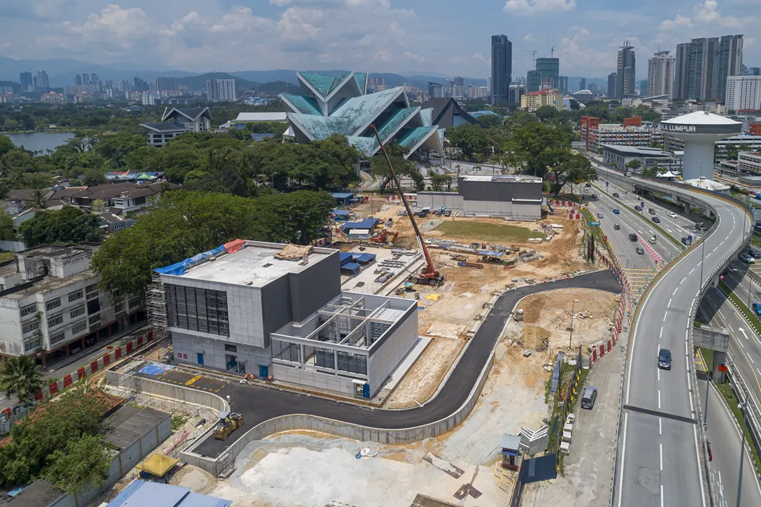 Overview of the completed road construction and the ongoing external works and architectural finishes at the Hospital Kuala Lumpur MRT Station
