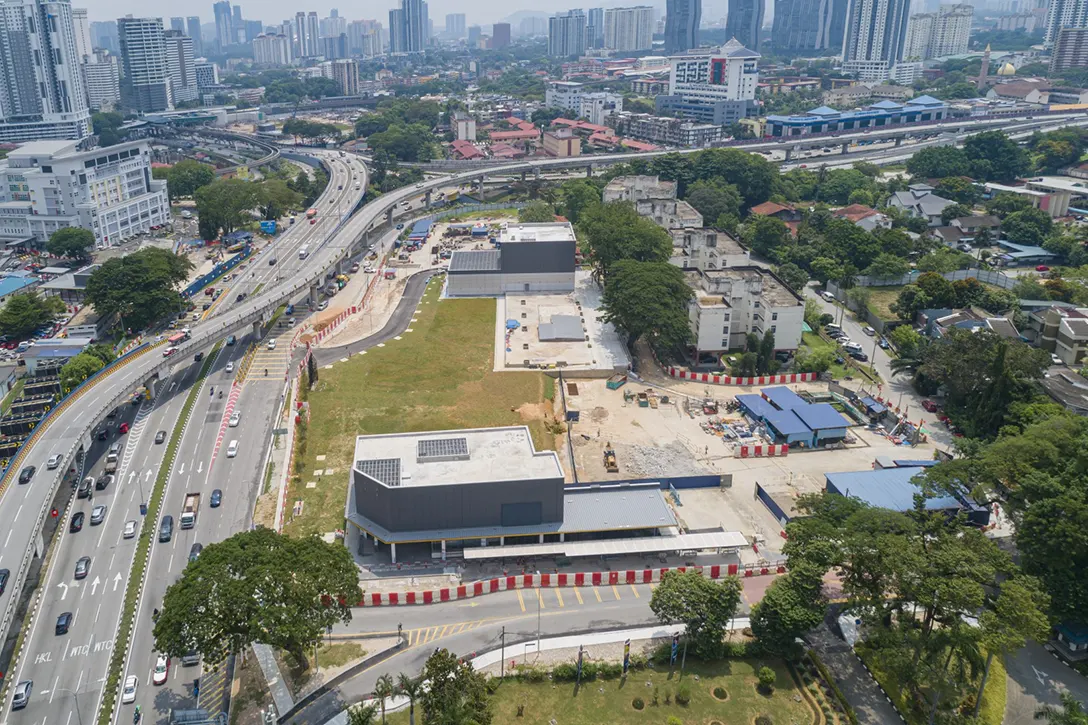 Completed external works at the surface level of the Hospital Kuala Lumpur MRT Station while site laydown removal works in progress.