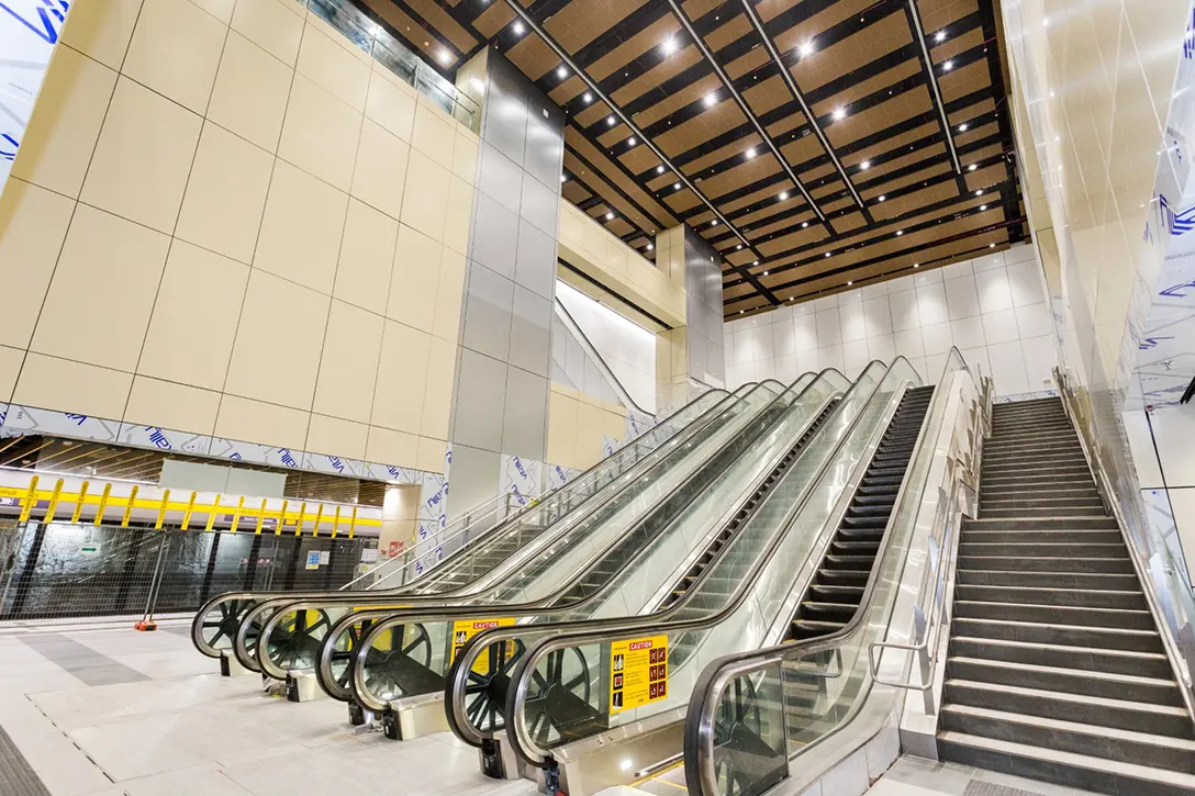 View of the completed escalator and architectural finishes from Hospital Kuala Lumpur MRT Station platform to roof levels.
