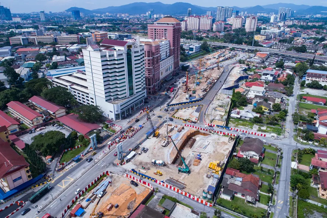 Aerial view of secant bore piling works and retaining wall construction at the Jalan Ipoh MRT Station site.