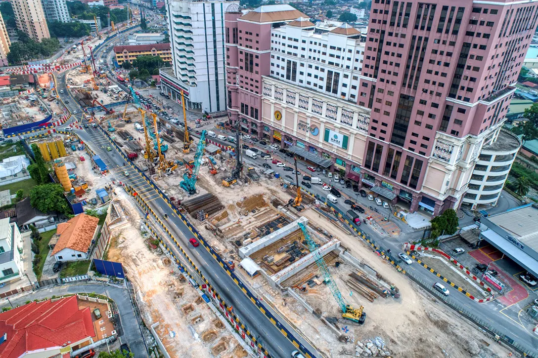 Aerial view of the Jalan Ipoh MRT Station site showing the portal beam and secant bore piling works in progress.