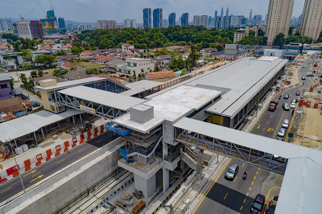Aerial view of the Jalan Ipoh MRT Station showing the mesh facade fixing works in progress.