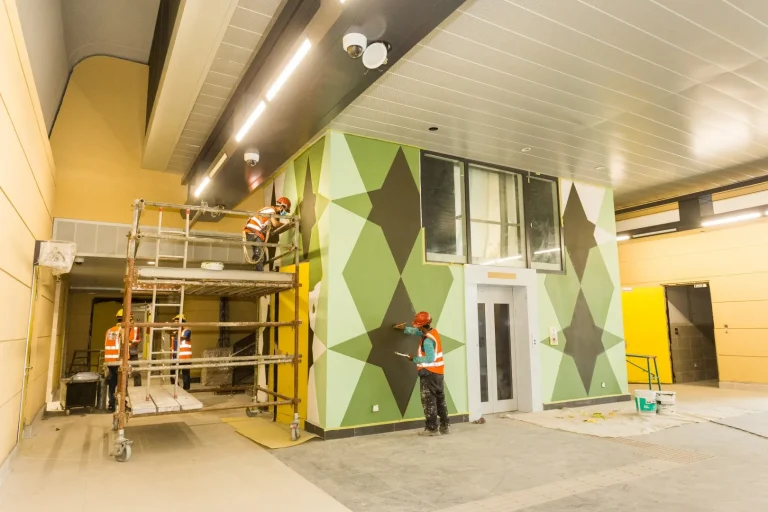 Inside view of the Jinjang MRT Station site showing the mural painting at lift concourse level works in progress