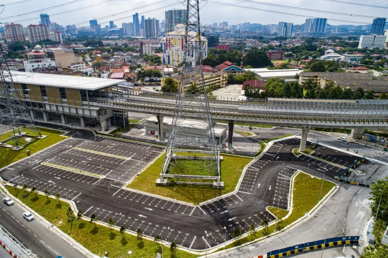Aerial view of the at-grade park and ride Kampung Batu MRT Station showing the street lighting works for parking bays in progress
