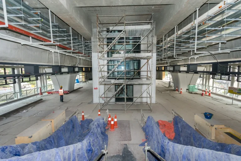 View of the glass panel installation for lift in progress at the Kampung Batu MRT Station site