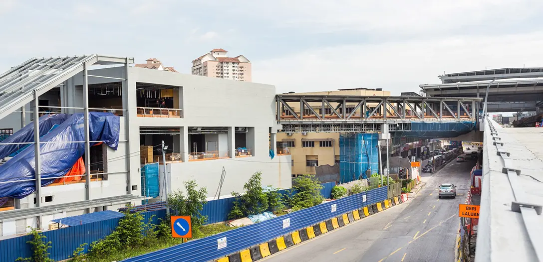 Steel structure installation at south entrance, screeding works at Pedestrian Overhead Bridge and roof installation at the Kentonmen MRT Station.