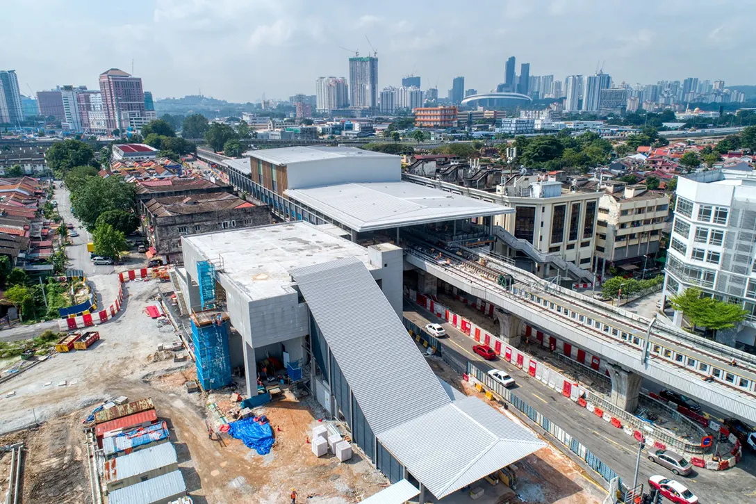 Aerial view of the Kentonmen MRT Station showing the electrical works and architectural mesh frame fixing in progress.