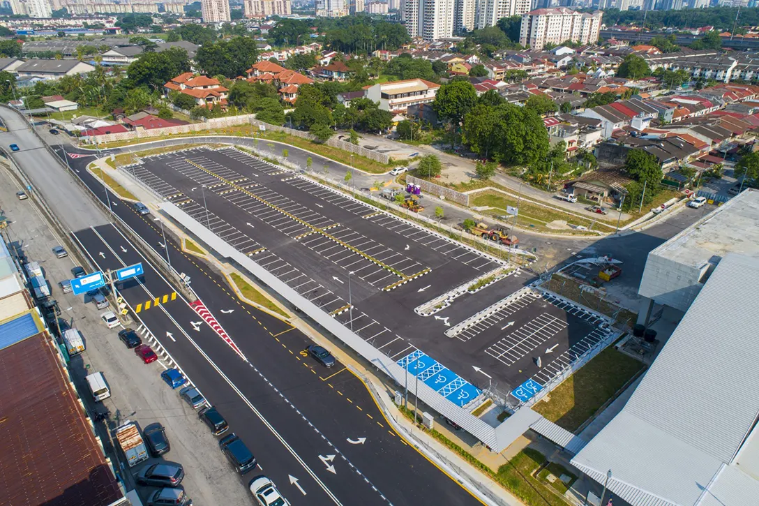 Aerial view of the Kentonmen MRT Station at-grade park and ride showing the final layer premix works pending.
