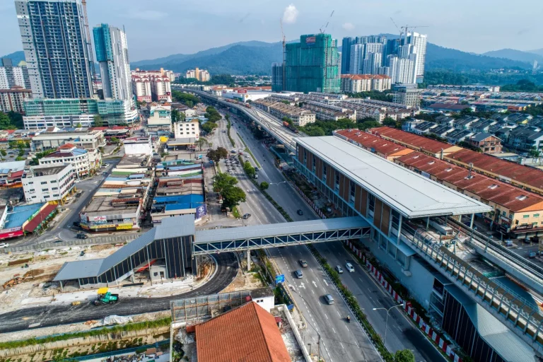 Aerial view of the Kepong Baru MRT Station site showing the installation of columns for covered walkway and roadworks in progress