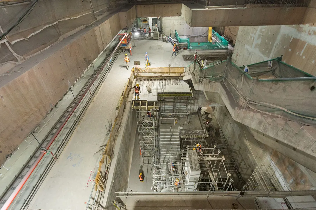 Staircase construction from lower platform to upper platform levels inside the Persiaran KLCC MRT Station.