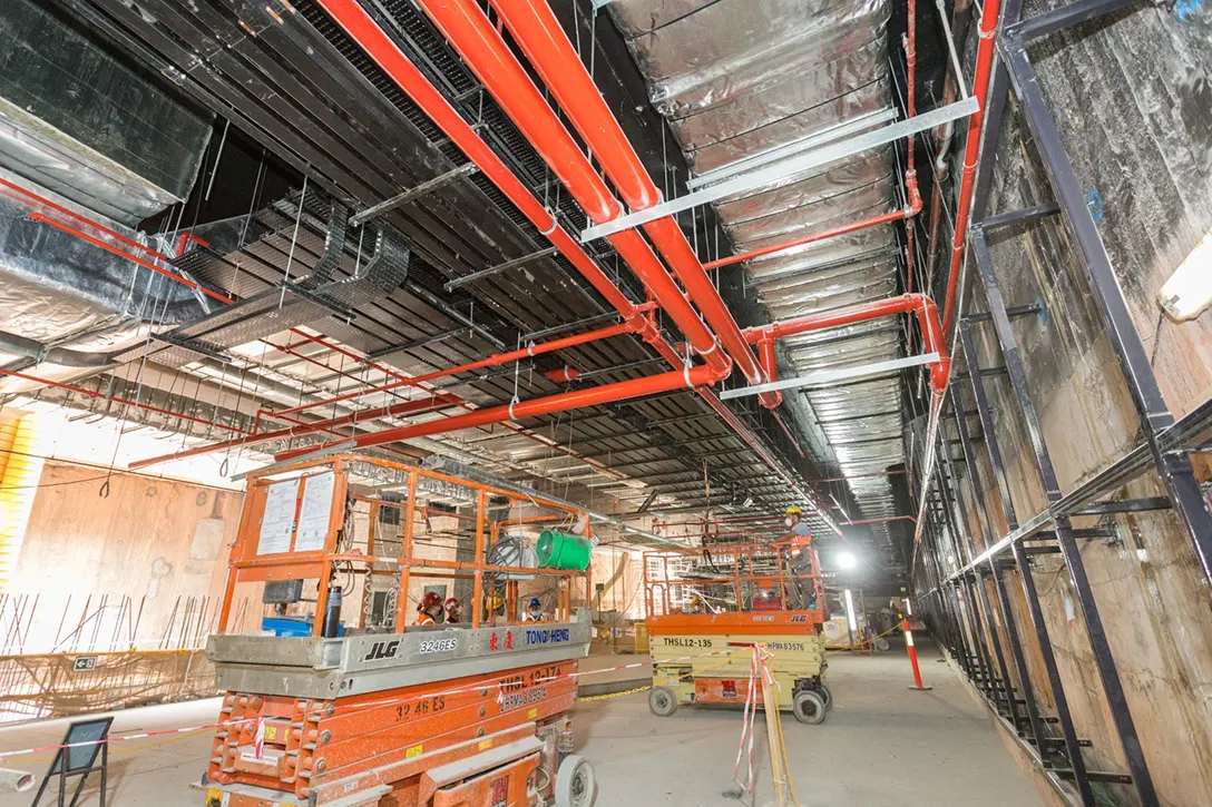 Mechanical, Electrical and Plumbing services installation in progress at the concourse level of the Persiaran KLCC MRT Station.