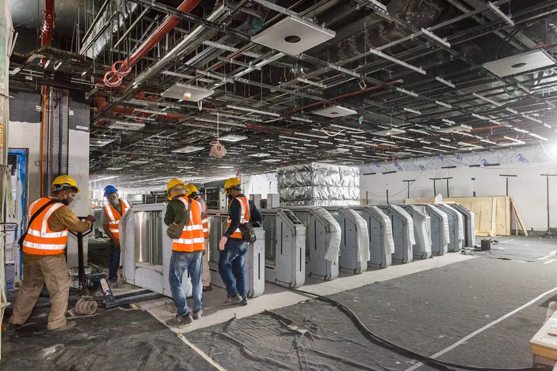 Installation of Automatic Fare Collection gate accessories at the concourse level of Persiaran KLCC MRT Station.