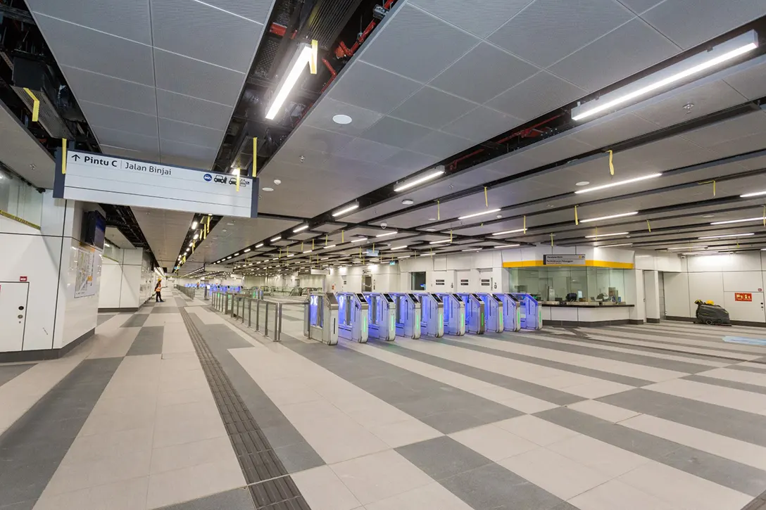 Automatic Fare Collection gate and customer service office at the Persiaran KLCC MRT Station concourse level.