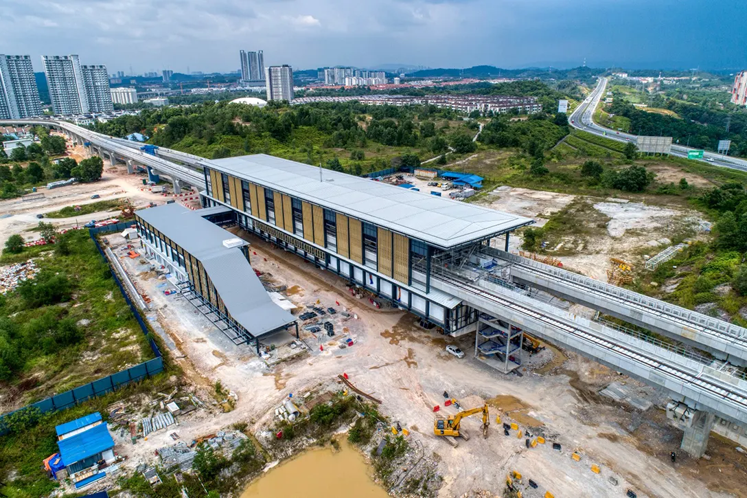 Aerial view of the 16 Sierra MRT Station showing the external trellis installation in progress.