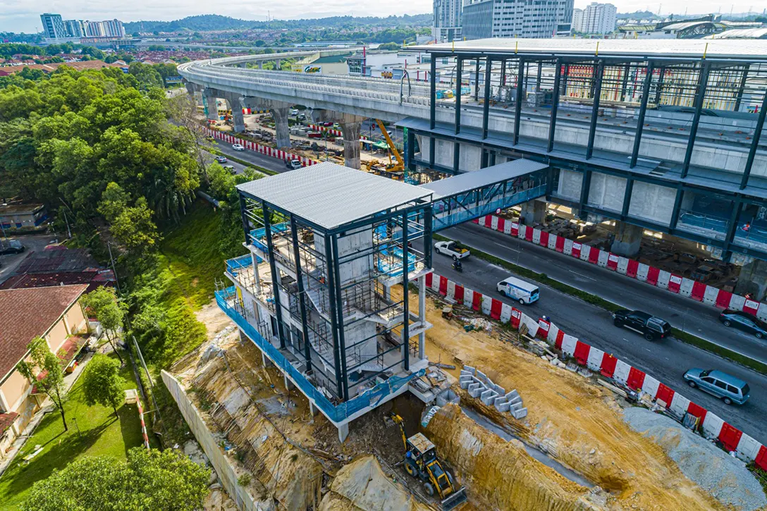 Aerial view of the Putra Permai MRT Station Pedestrian Overhead Bridge showing the Entrance 2 architectural works in progress.