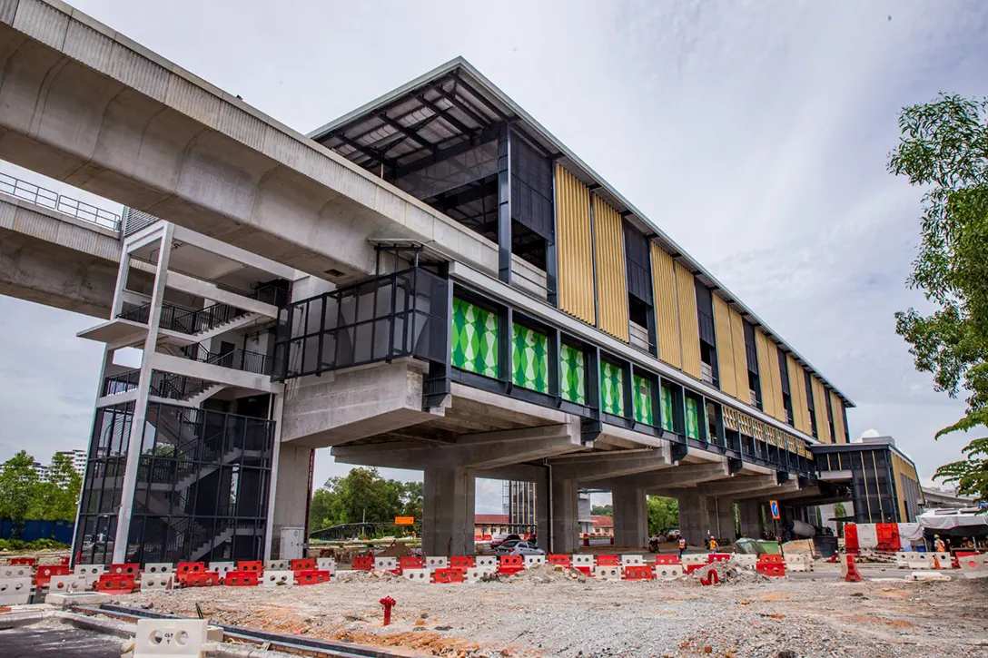 Final architectural finishing and external works in progress at the Putra Permai MRT Station.