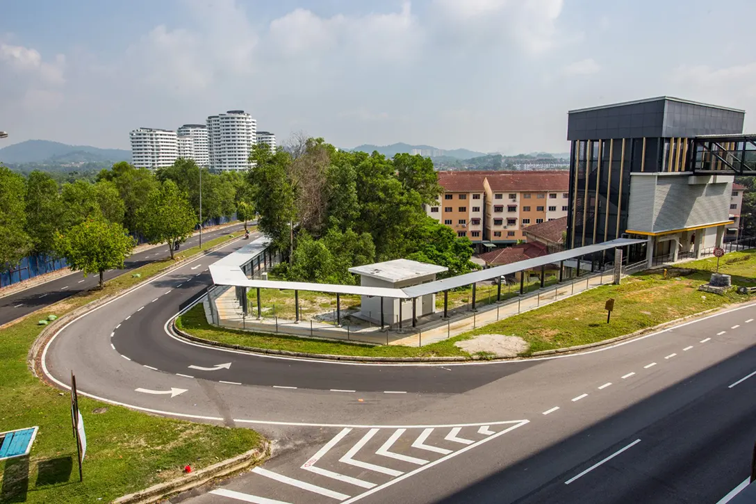 View of the Putra Permai MRT Station showing the Entrance 2 staircase works at the end of the covered walkway in progress.