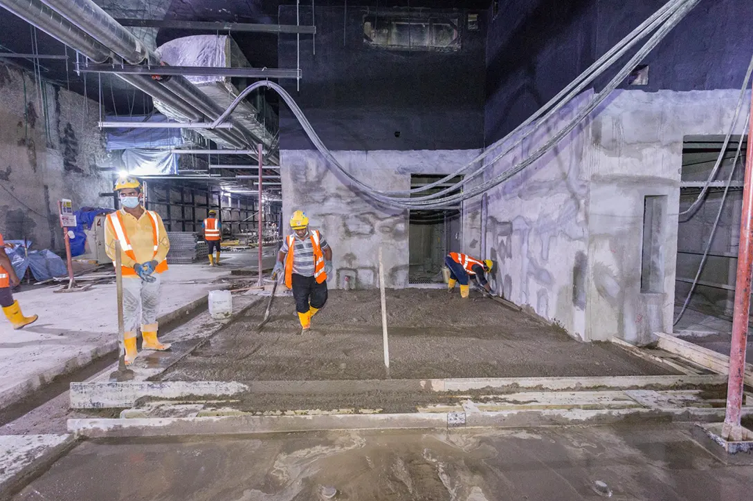 Screeding works in progress at the concourse level of the Raja Uda MRT Station.
