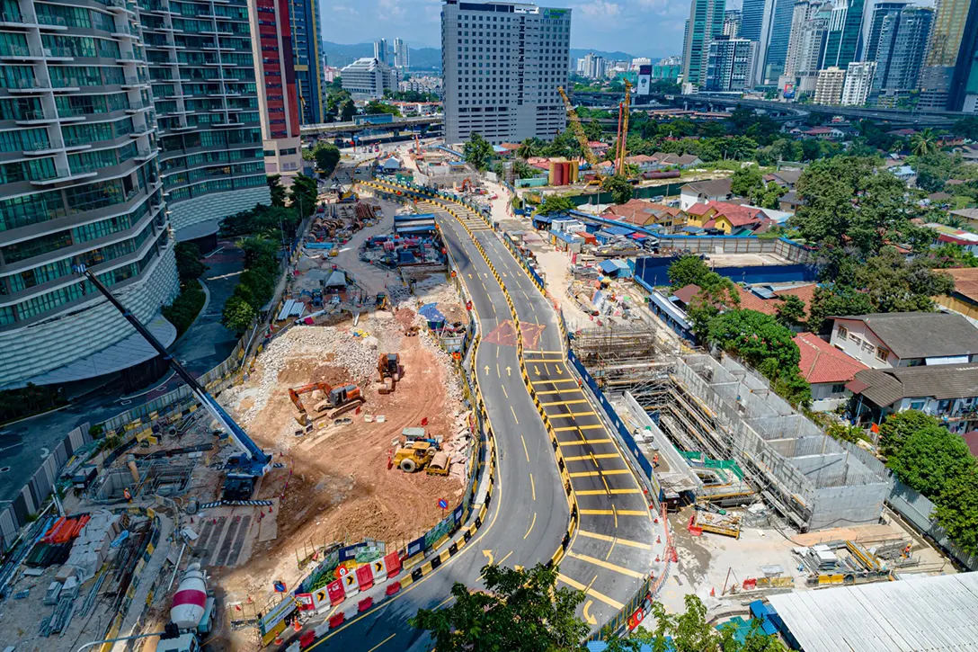 Aerial view of the Raja Uda MRT Station showing the preparation for permanent relocation of utilities and reinforced concrete structure works of Entrance A and Ventilation Building A in progress