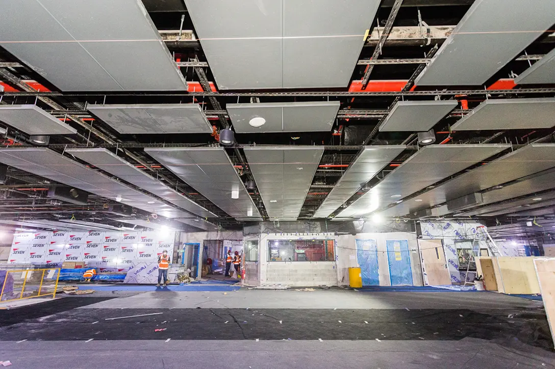 Ceiling panels installed and the alignment adjusted at concourse level of the Raja Uda MRT Station.