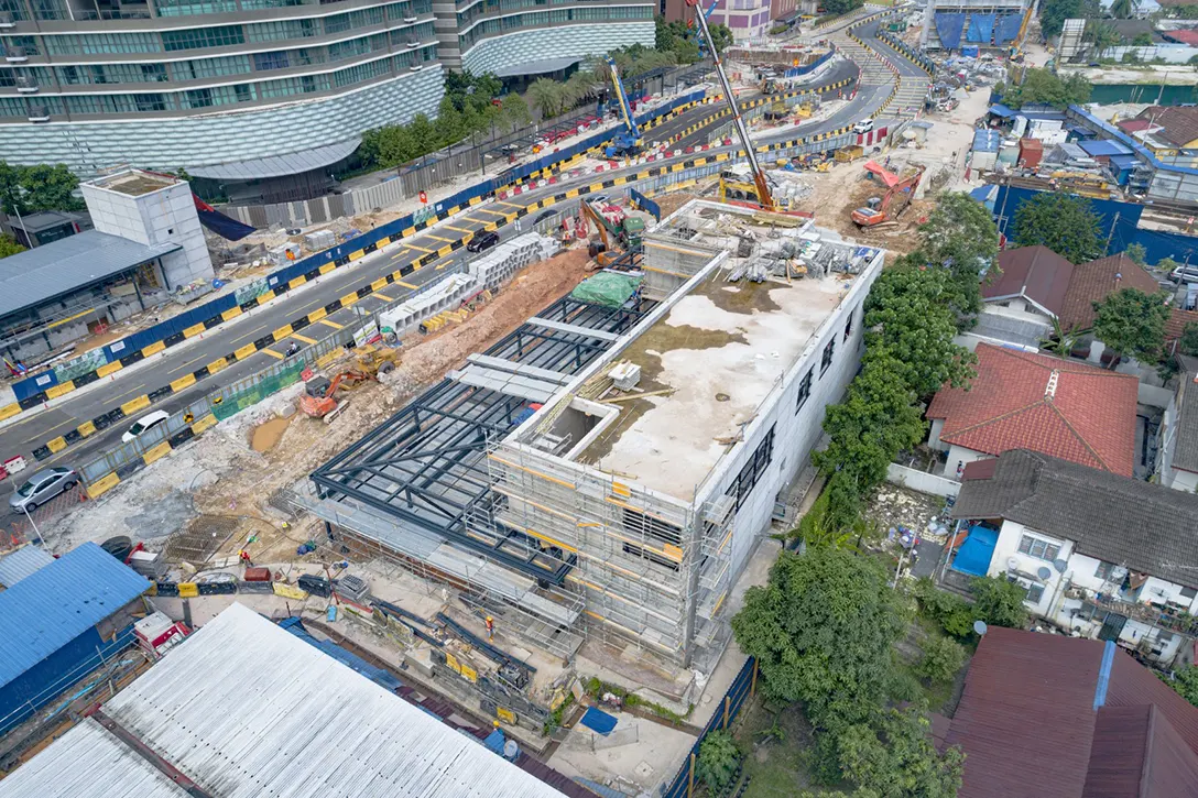 Aerial view of the completed Entrance A and Ventilation A building structures of Raja Uda MRT Station and works in progress to complete the remaining external finishes of the building.