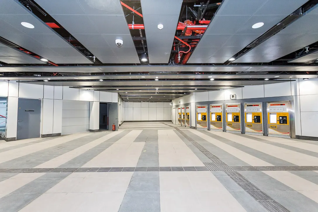 Interior view of the Ticket Vending Machine and retail areas at the Raja Uda MRT Station concourse level.