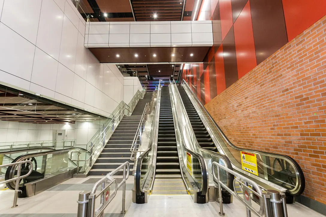 View of the Sentul Barat MRT Station escalators from lower concourse level.