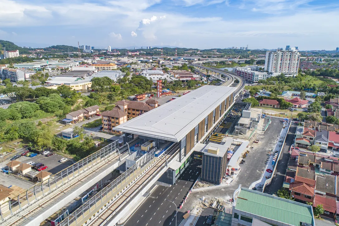 Aerial view of the Serdang Jaya MRT Station showing the road median screeding and road signage installation works in progress.