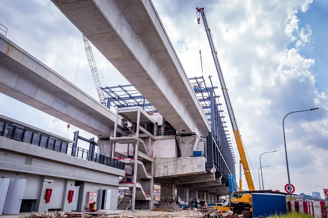 Roof sheet installation works in progress at the Serdang Raya Selatan MRT Station site.