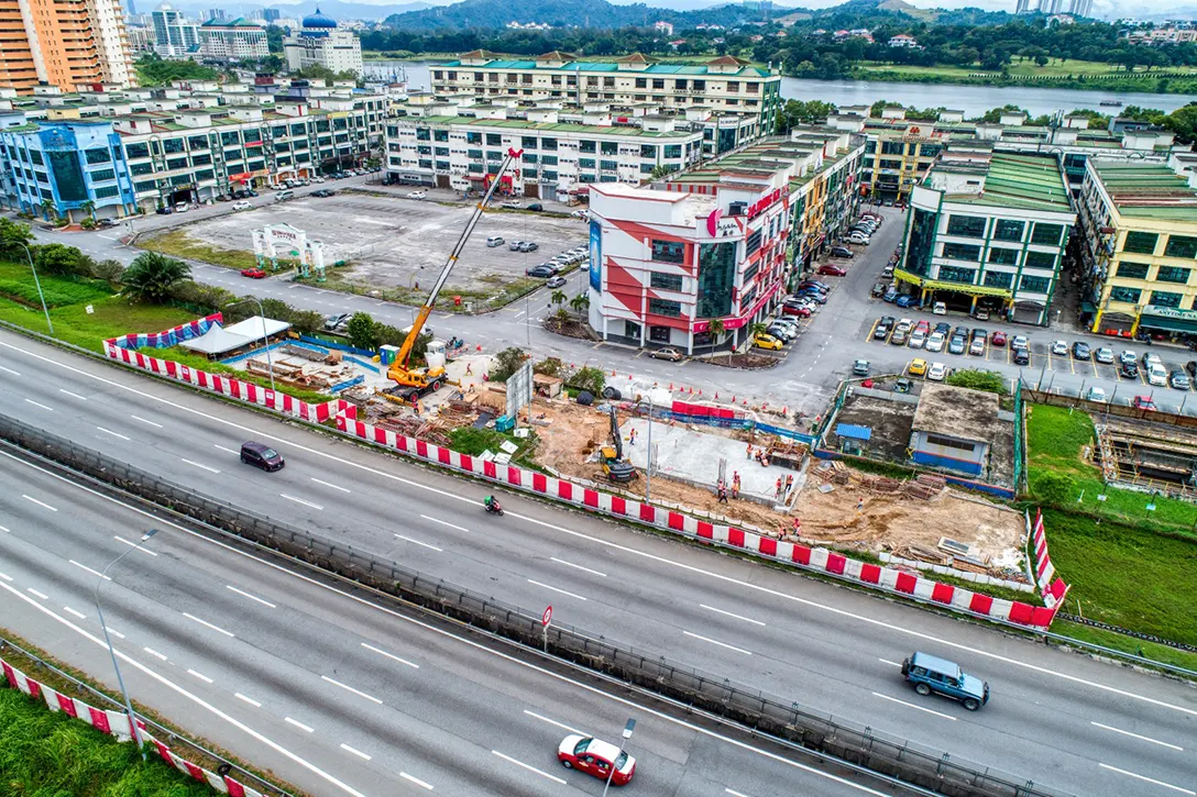 Aerial view of the pedestrian overhead bridge for the Serdang Raya Selatan MRT Station showing the Entrance B structural works in progress.