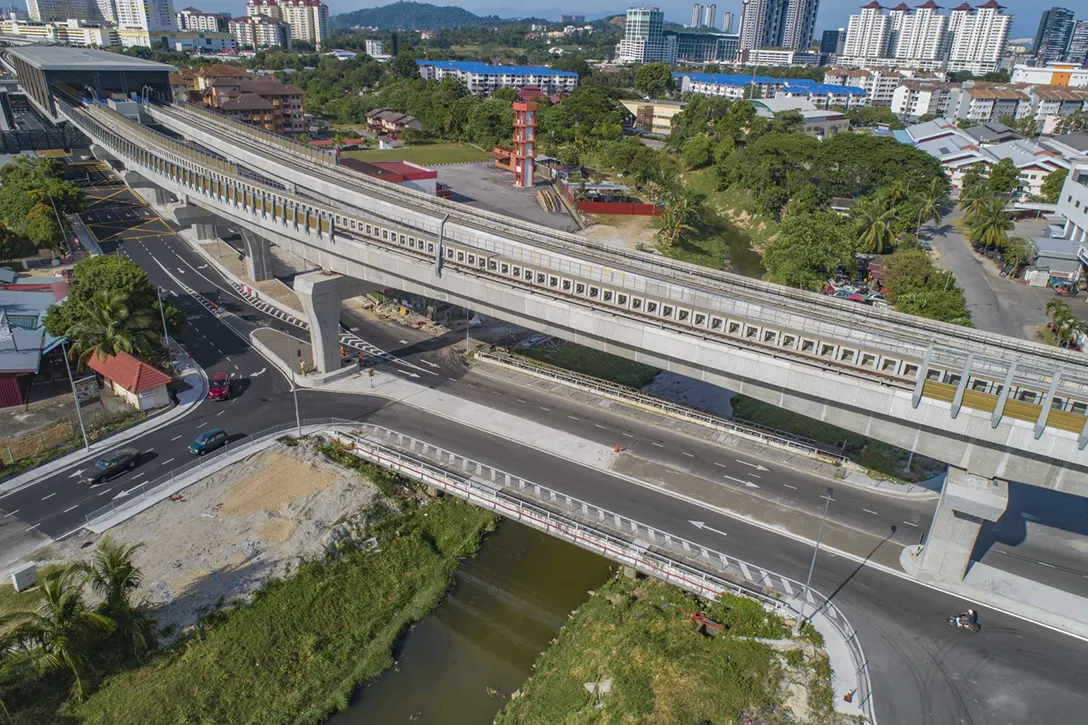 Aerial view of the alignment crossing Jalan Raya 1 between Serdang Raya Selatan Station and Serdang Jaya Station showing the road median screeding works in progress.