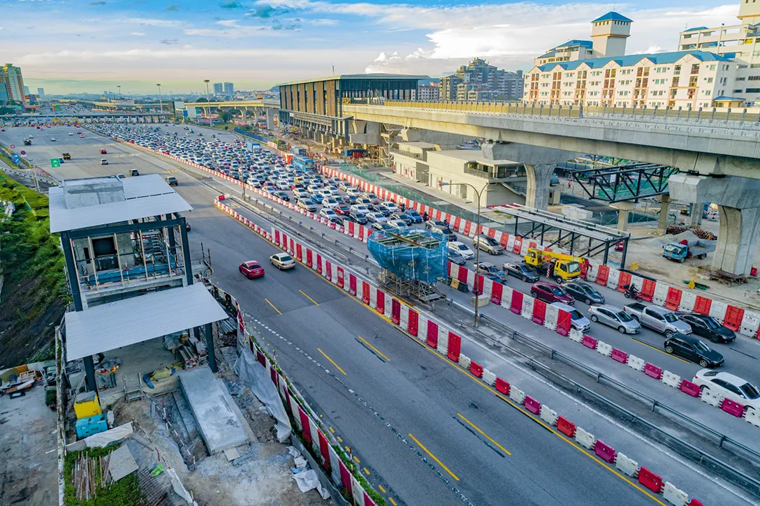 Aerial view of the Serdang Raya Utara MRT Station showing civil and structural works for Entrance B and preparation for launching of Pedestrian Overhead Bridge.