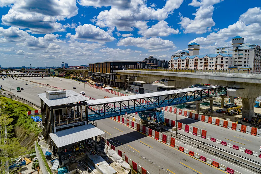 Aerial view of the Pedestrian Overhead Bridge of Serdang Raya Utara MRT Station showing the architectural works in progress.