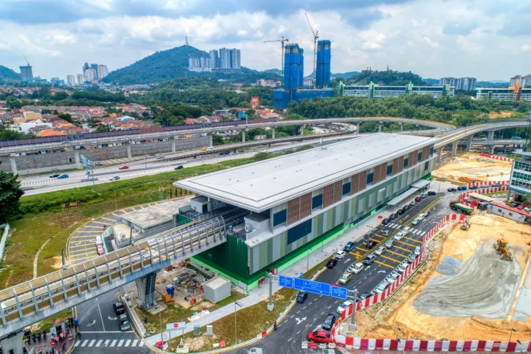 Aerial view of the Sri Damansara Sentral MRT Station showing the station external works in progress such as roadworks and on site detention pond
