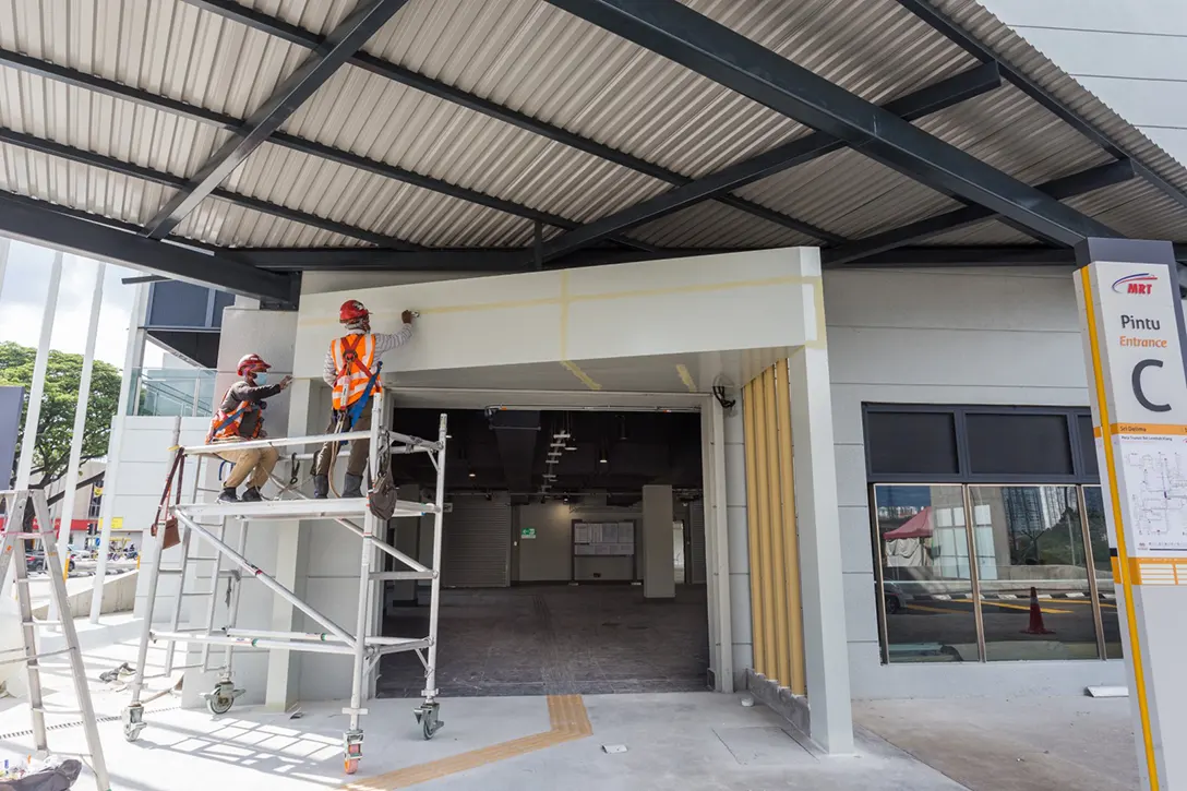 Ongoing touch-up paint works in progress at the Sri Delima MRT Station