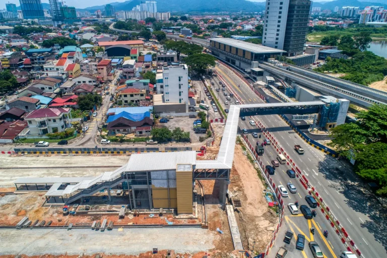 Aerial view of the Sri Delima MRT Station site showing the external mesh fixing works in progress