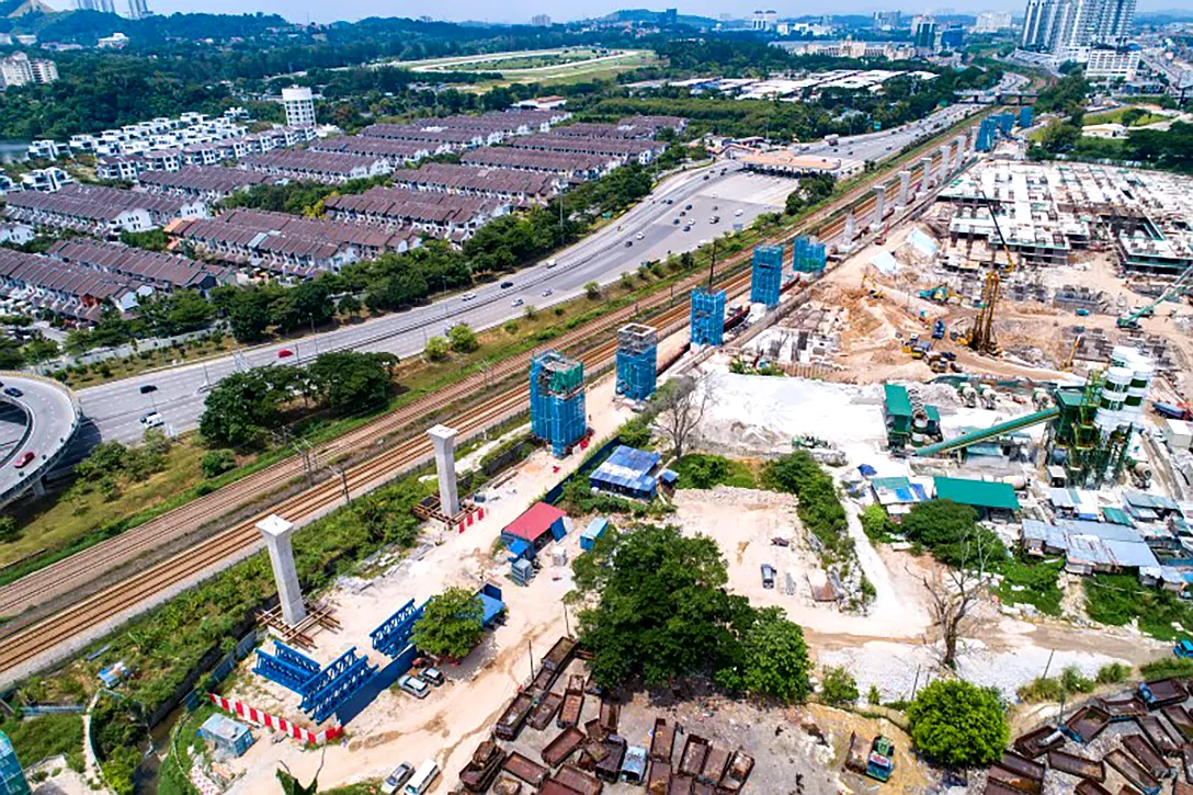 Aerial view of pier column and pier head construction at the Sungai Besi MRT Station site.