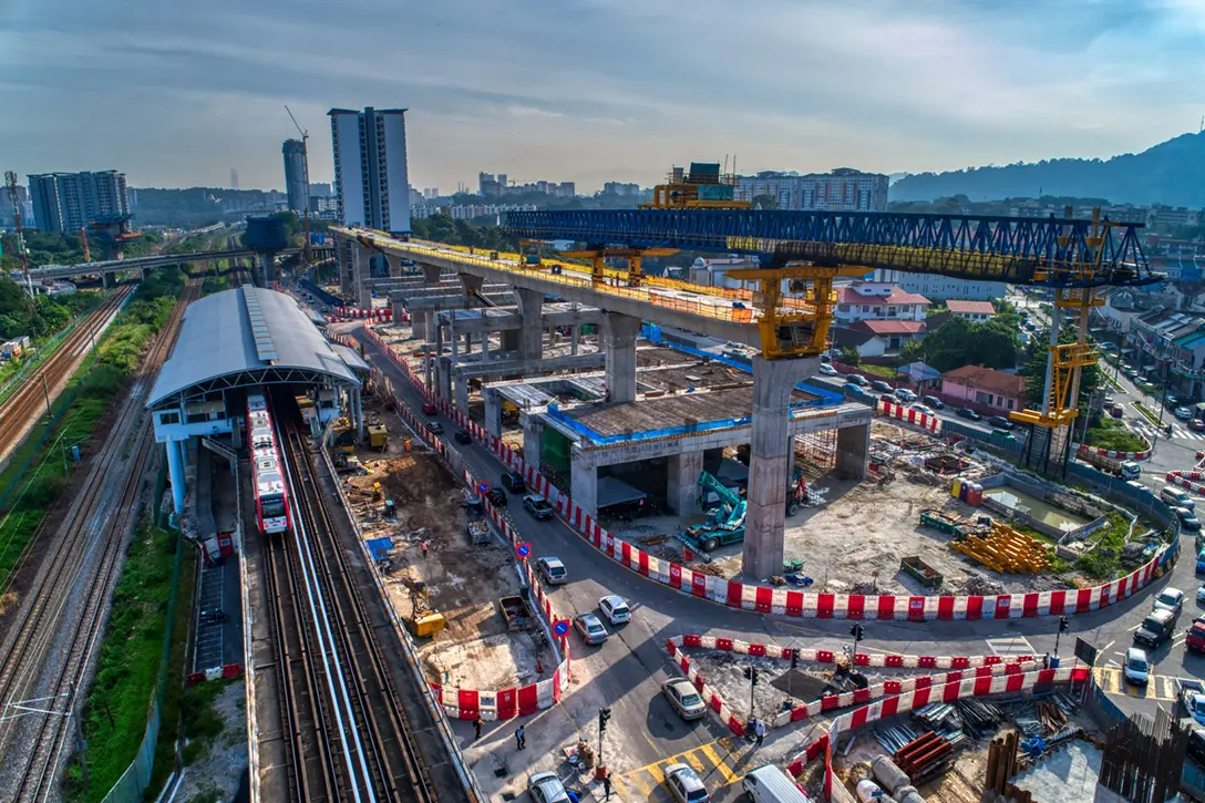 View of the construction works for concourse cross beam segmental pier head as well as erection works for segmental box girder at the Sungai Besi MRT Station site.
