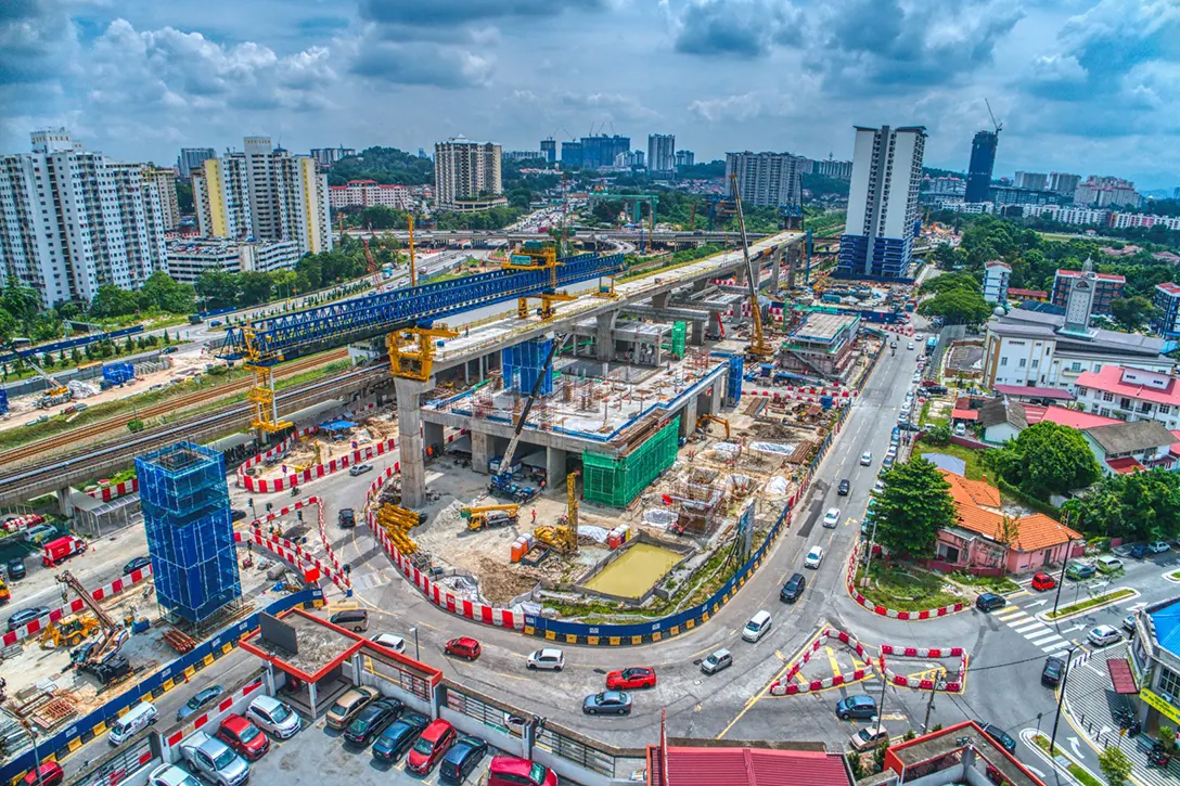 Aerial view of the span adjustment and pier construction at the Sungai Besi MRT Station site.