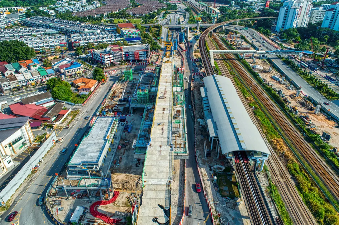 Aerial view of the completed reinforced concrete kerb and pier head construction at the Sungai Besi MRT Station site.