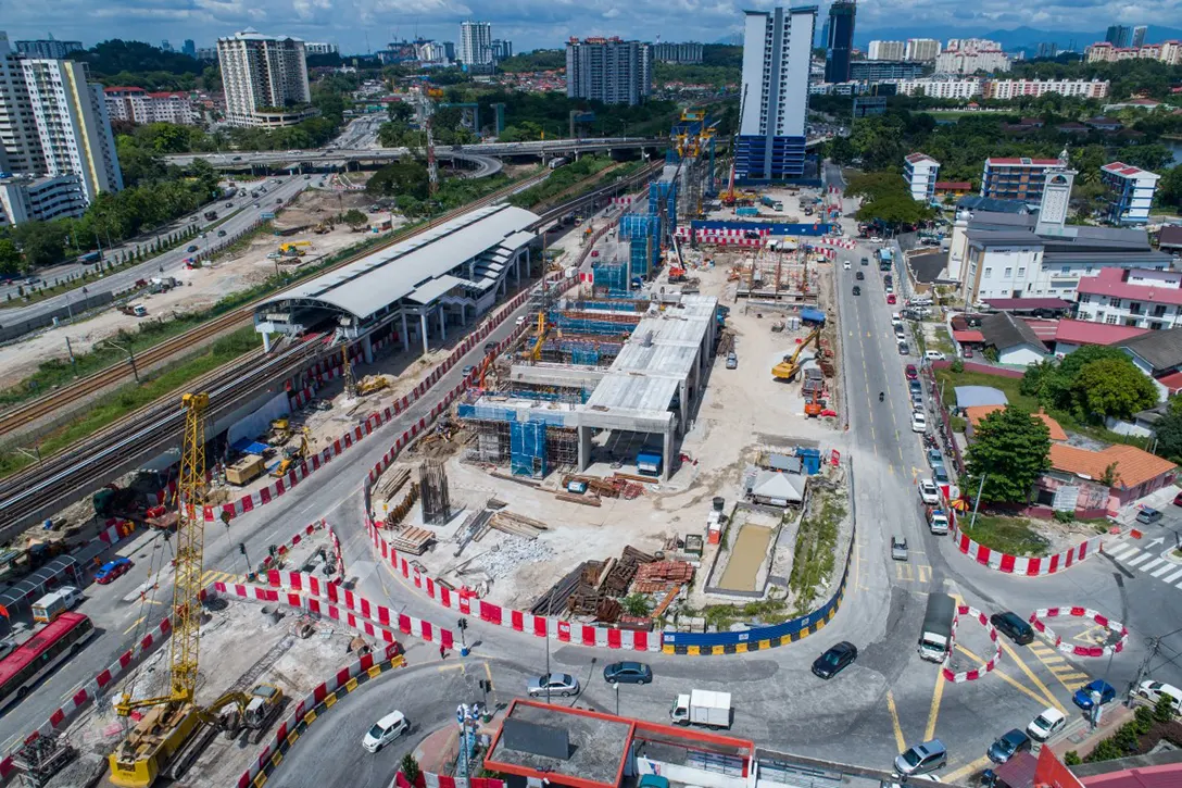 Aerial view of the ongoing works for pile cap, pier column, pier head, bore pile as well as launching of segmental box girder and t-beam at the Sungai Besi MRT Station site.