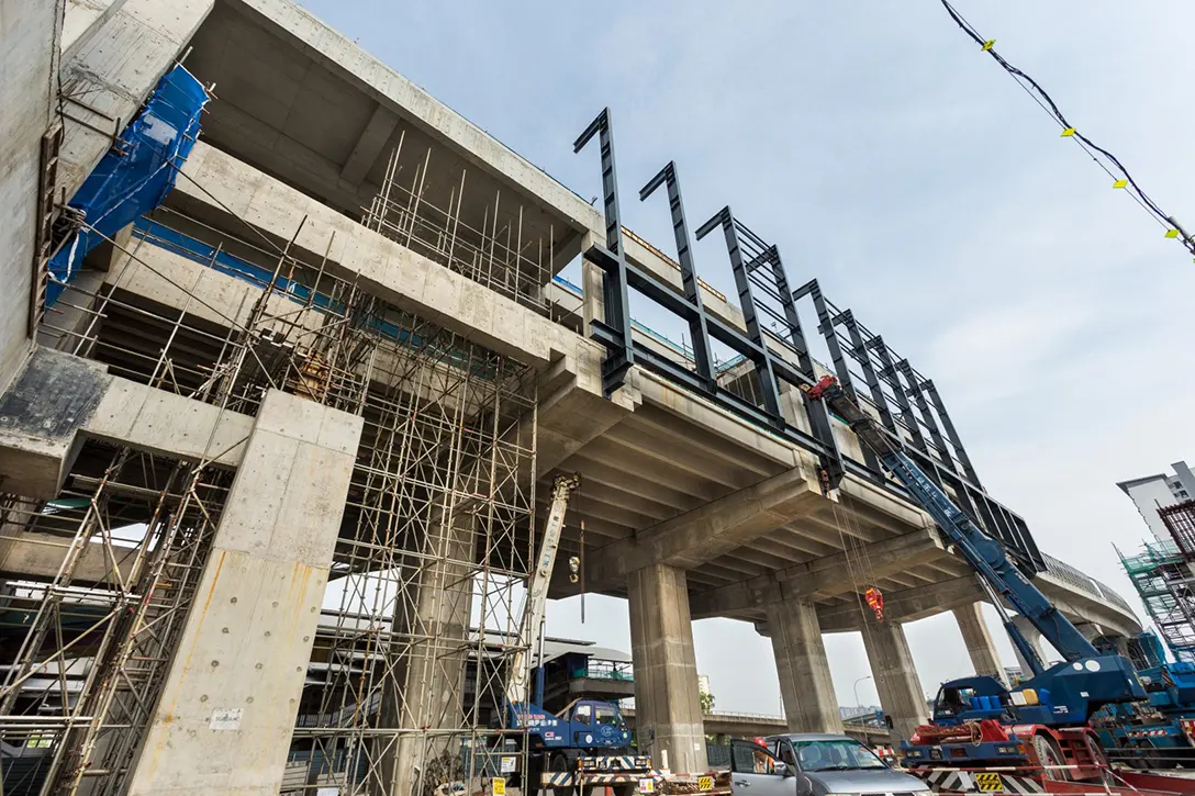 Installation of steel structure for portal frame at the station box of the Sungai Besi MRT Station.