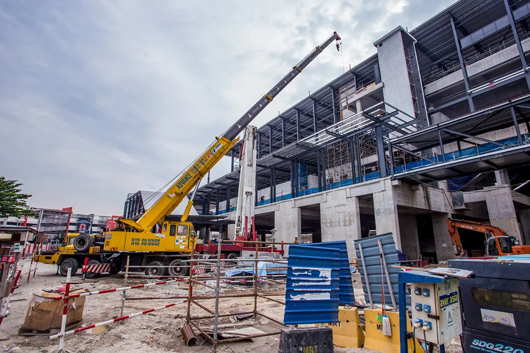 View of the Sungai Besi MRT Station site showing the steel structure installation works in progress.