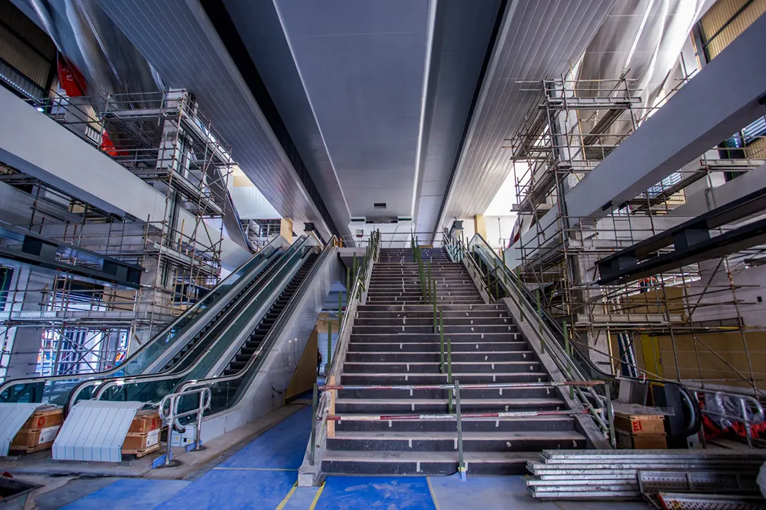 View of the Sungai Besi MRT Station showing the escalator and staircase installation works in progress.